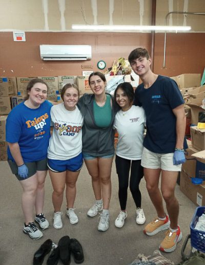 Volunteers posing for a group photo at Hangers of Hope Thrift Stores Benefiting the Bethesda Health Clinic in Tyler, TX