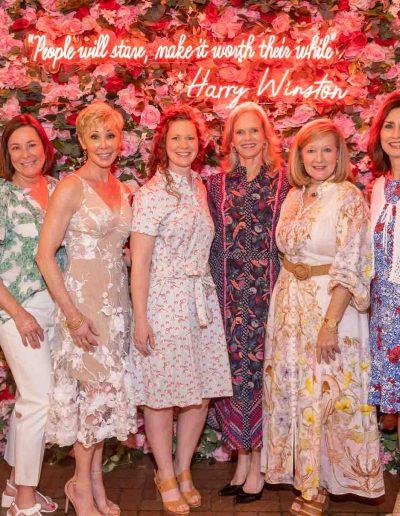 People standing for a picture at the Runway for Hope at Hangers of Hope Thrift Stores Benefiting the Bethesda Health Clinic in Tyler, TX