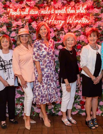 People standing for a picture at the Runway for Hope at Hangers of Hope Thrift Stores Benefiting the Bethesda Health Clinic in Tyler, TX