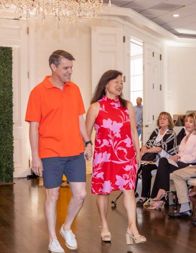 People walking at the Runway for Hope at Hangers of Hope Thrift Stores Benefiting the Bethesda Health Clinic in Tyler, TX