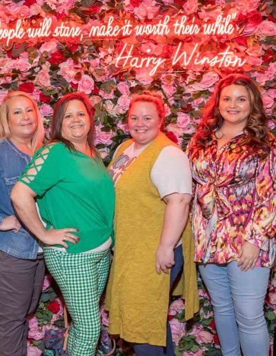 People standing for a picture at the Runway for Hope at Hangers of Hope Thrift Stores Benefiting the Bethesda Health Clinic in Tyler, TX