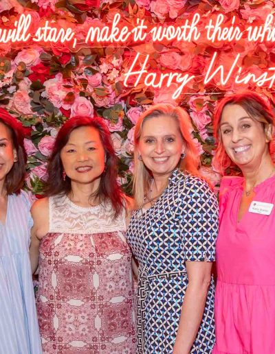 People standing for a picture at the Runway for Hope at Hangers of Hope Thrift Stores Benefiting the Bethesda Health Clinic in Tyler, TX