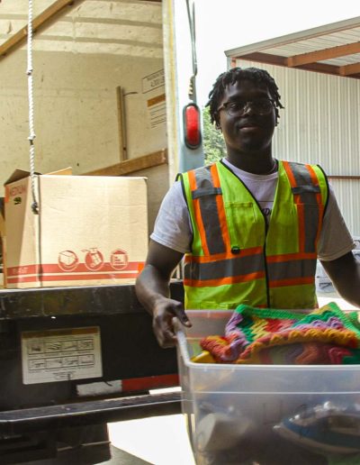 Volunteers unloading a truck at Hangers of Hope Thrift Stores Benefiting the Bethesda Health Clinic in Tyler, TX