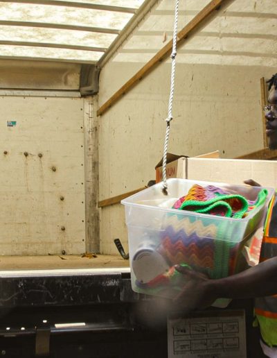 Volunteers unloading a truck at Hangers of Hope Thrift Stores Benefiting the Bethesda Health Clinic in Tyler, TX