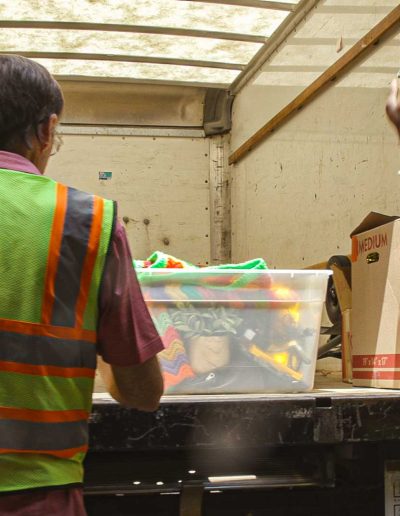 Volunteers unloading a truck at Hangers of Hope Thrift Stores Benefiting the Bethesda Health Clinic in Tyler, TX