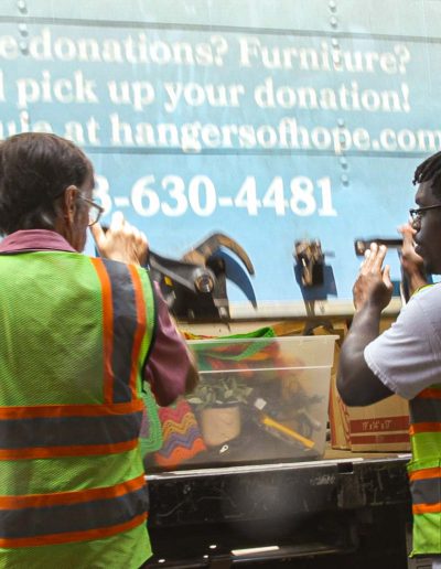 Volunteers unloading a truck at Hangers of Hope Thrift Stores Benefiting the Bethesda Health Clinic in Tyler, TX